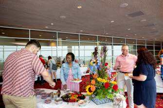 Meeting attendees enjoying food at Monona Terrace during a meeting in Madison