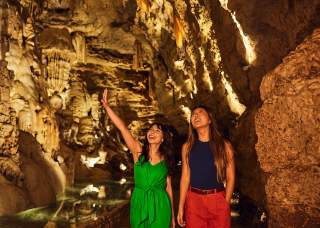 Two girls inside cavern