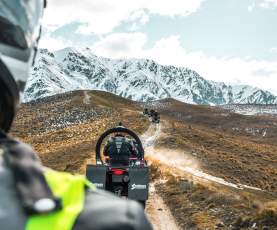 Quad biking on a dirt track at the top of a mountain