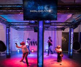 People in a colourful virtual reality area
