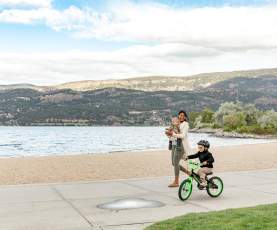 Child_Riding_Bike_with_Mother_Nearby_10_