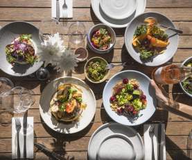 Top view of a selections of colourful lunch dishes
