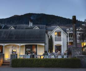 Outside shot of Botswana Butchery Restaurant historic building at dusk