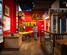 A person going through the Chinese exhibit at the Nanaimo Museum.