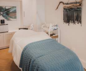 The massage bed neatly made.