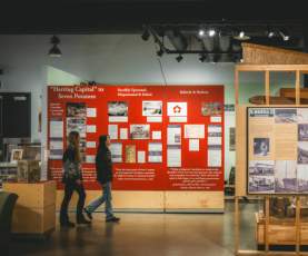 Two people walking through a museum.