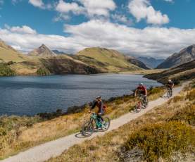 Friends mountain biking around Moke Lake
