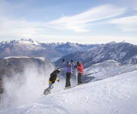 Three Friends Skiing Coronet Peak