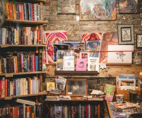 A collection of vintage books and record discs.