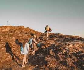 Three women and a dog hike to the top of sugarloaf