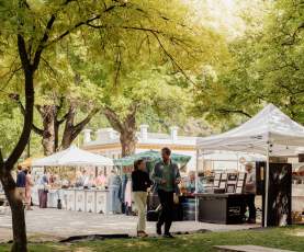 People walking through Arrowtown market