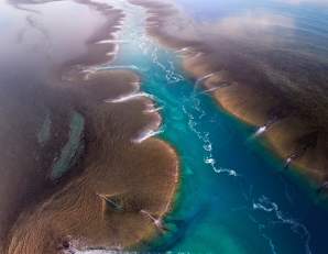 Aerial view of a channel flowing through Yowjab/Montgomery Reef on the Kimberley Coast
