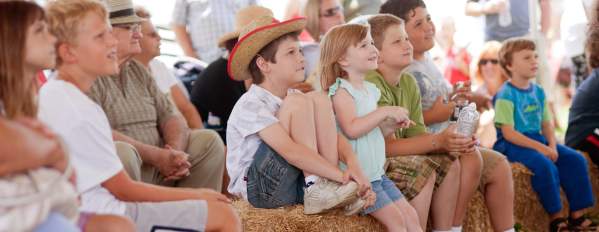 Children watch a show at the Kutztown Folk Festival