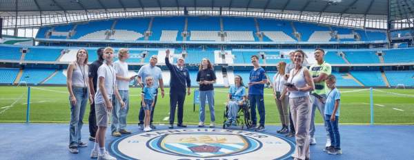 Group of fans inside football stadium on a tour