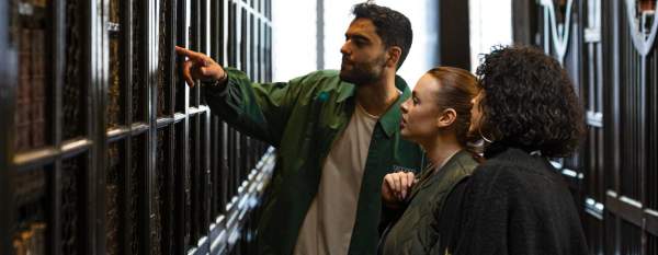 People browsing shelves at Chetham’s Library