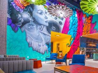 Large mural painted on wall inside museum lobby