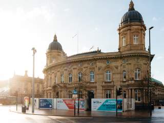 Hull Maritime Museum exterior with ornate historic architecture and colourful flower displays on a sunny day