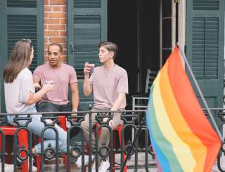 LGBTQ Friends Having Drinks on a French Quarter Balcony