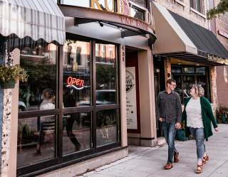 Couple walking in Downtown Oshkosh