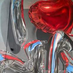 Street art showing helium balloons spelling out I heart NB