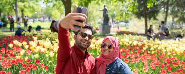 Couple taking selfie on phone at Centennial Park
