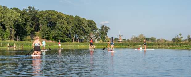 Paddle boarding on the Black River with DeZwaan Windmill on the horizon