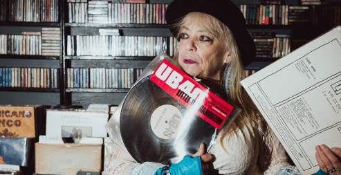 A person holding a vinyl record.