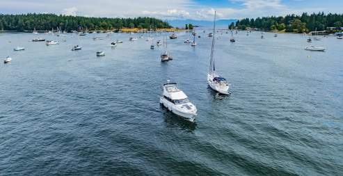 Two boats leaving the dock.