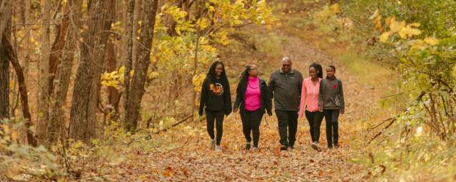 Family of five hiking in the fall.