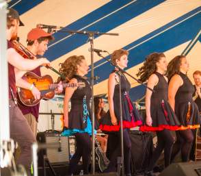 Row of Celtic dancers on stage in Saline