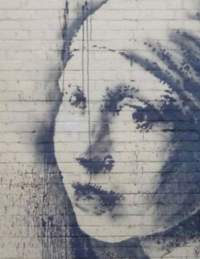 Banksy's 'The Girl With The Pierced Eardrum' street art on Bristol's Harbourside - credit Visit Bristol