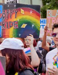People holding banners in the Bristol Pride parade - Credit Matt Whiteley