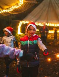 Children with Christmas sparkelers at Mendip Activity Centre - credit Mendip Activity Centre