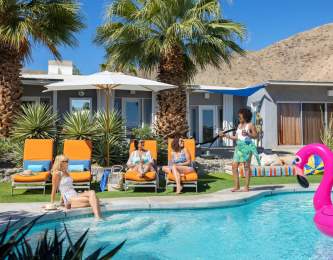 Girls relaxing poolside at a vacation rental.