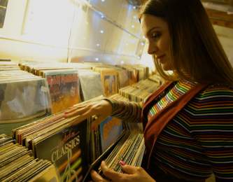 Woman looking at vinyl collection