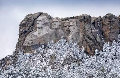 Mount Rushmore covered in frost during the winter season