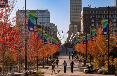 People walking along a path at The RiverFront in the fall.