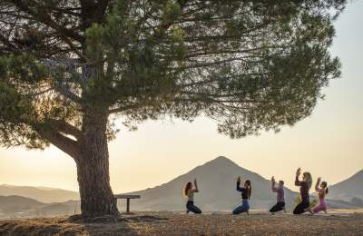 ladies doing yoga in outdoors