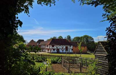 A view of the toll house garden with market square in background at Weald & Downland museum