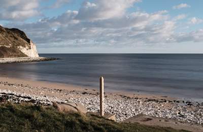 Active beacon photopost on the pebble beaches of East Yorkshire.