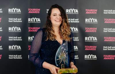 Award winner with trophy at the REYTAs