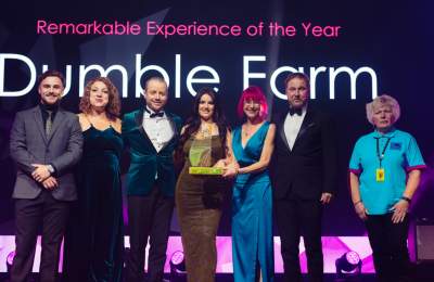 Dumble farm staff on stage receiving their REYTA award