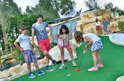 Children playing golf at Jungle Paradise