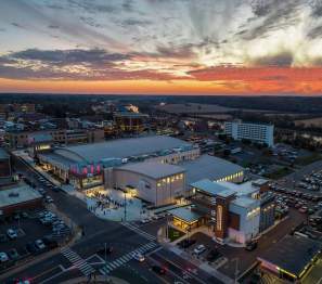 aerial shot of downtown buildings with a vivid sunset