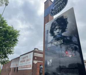 sign of Jimi Hendirx in front of an historic music store