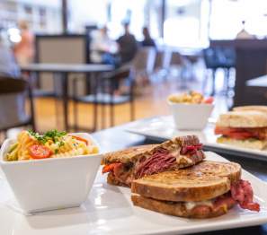 plates of sandwiches and pasta