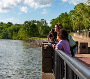 family at an overlook along the Riverwalk