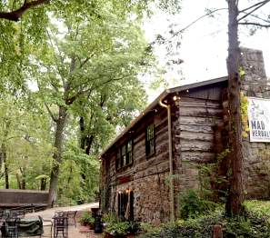 a cabin-style restaurant in a wooded setting