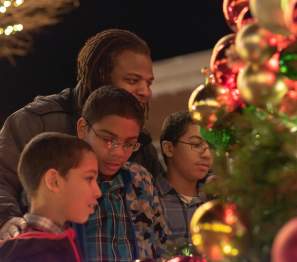 family looking at a Christmas Tree