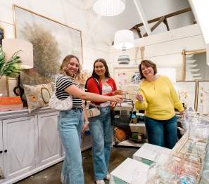 Women enjoying a shopping trip at Miss Lucille's.